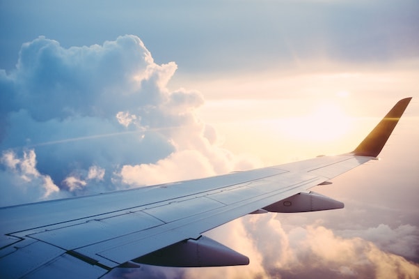 Plane flying over the ocean